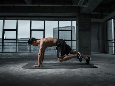 A person in quiet contemplation before a workout session.